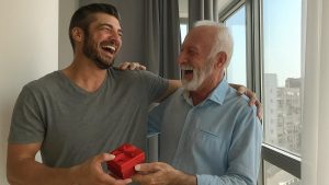 son is giving a watch to his dad
