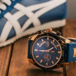 Watch and shoe combinations placed on a wooden platform focused on same blue color